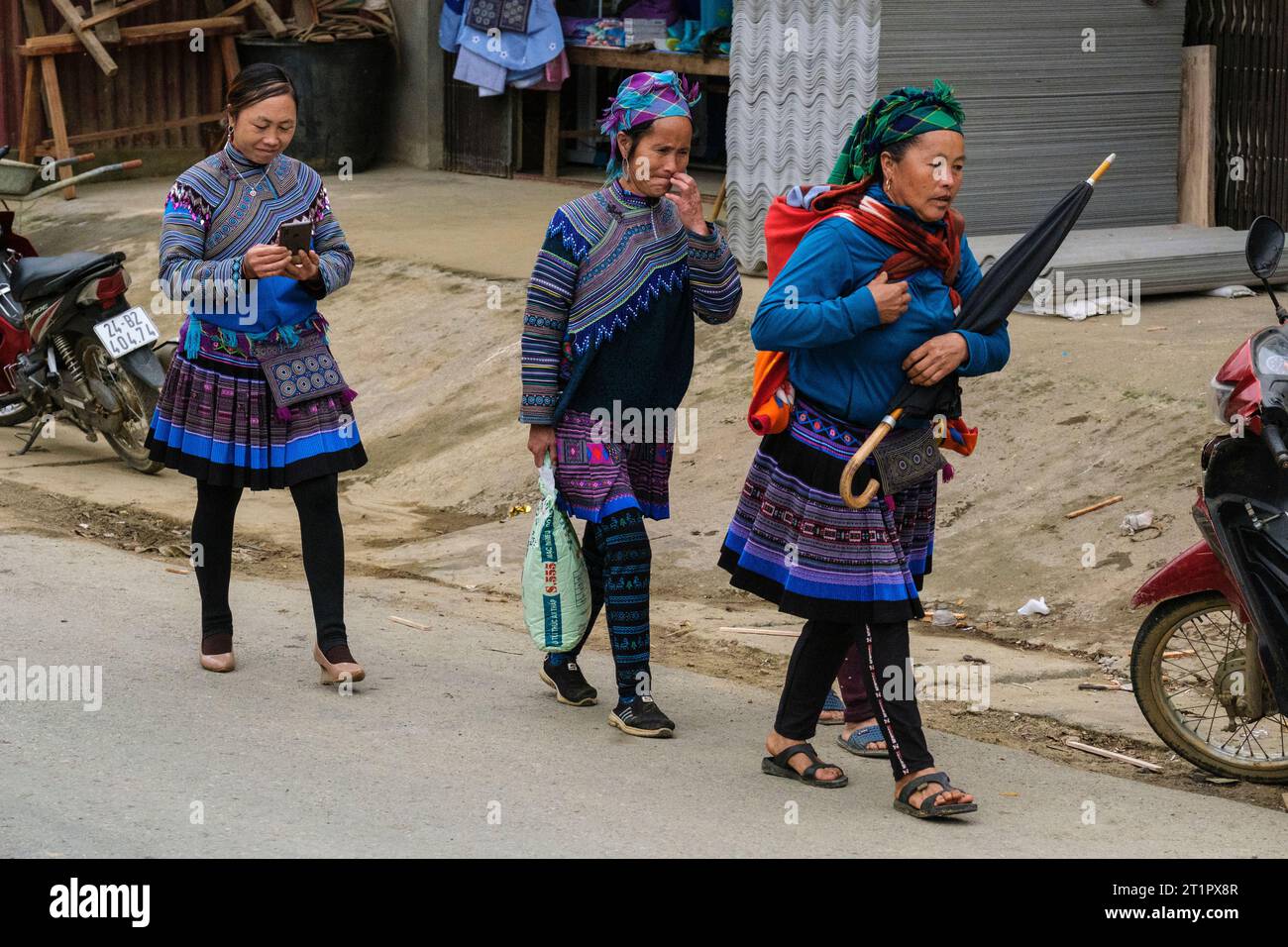 Can Cau Street Scene, Vietnam. Three Hmong Women in Traditional Dress.  Lao Cai Province. Stock Photo