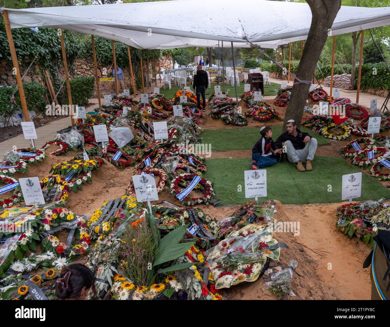 Jerusalem, Israel. 15th Oct, 2023. Israelis visit some of the more than 30 graves freshly dug in the past week as they visit loved ones buried in the Mt. Herzl Military Cemetery in Jerusalem on October 15, 2023. Civilians killed in terrorist attacks are routinely buried in Israel in military cemeteries. There are more than 30 freshly dug graves that hold Israelis killed by the Hamas terror group in their attacks into southern Israel on October, 7, 2023. Photo by Jim Hollander/UPI Credit: UPI/Alamy Live News Stock Photo