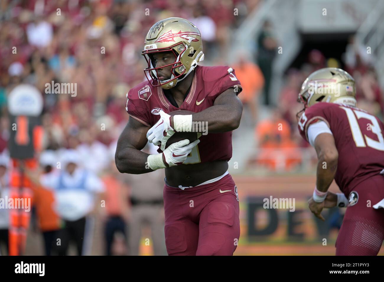 Florida State running back Trey Benson (3) rushes for yardage during