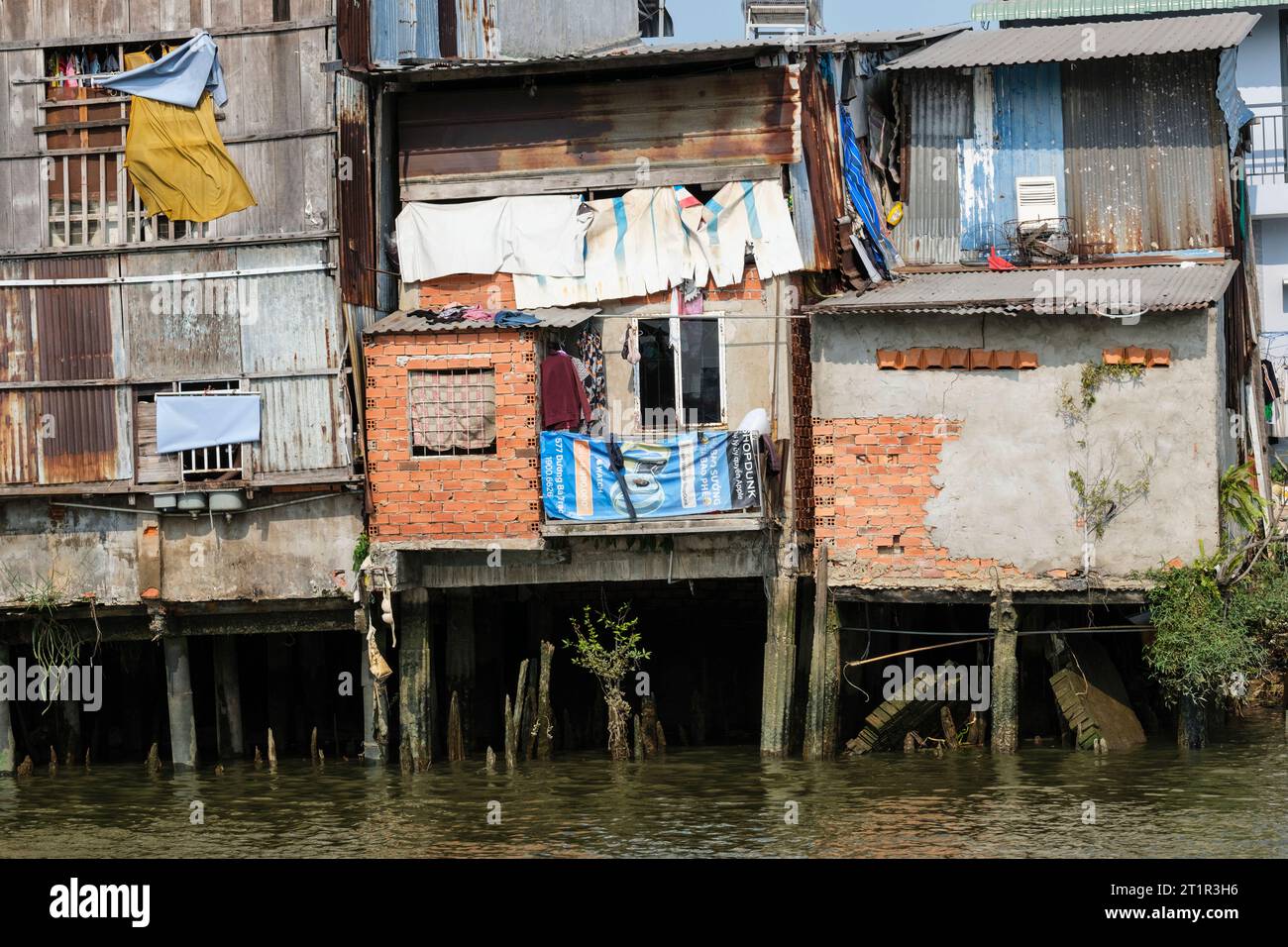 Saigon Riverside View near Ho Chi Minh, Vietnam. Lower-class Housing. Stock Photo