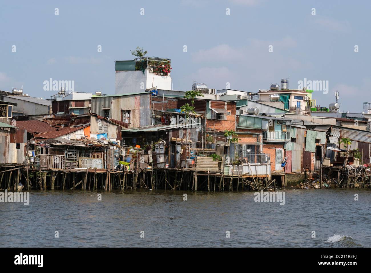 Saigon Riverside View near Ho Chi Minh, Vietnam. Lower-class Housing. Stock Photo