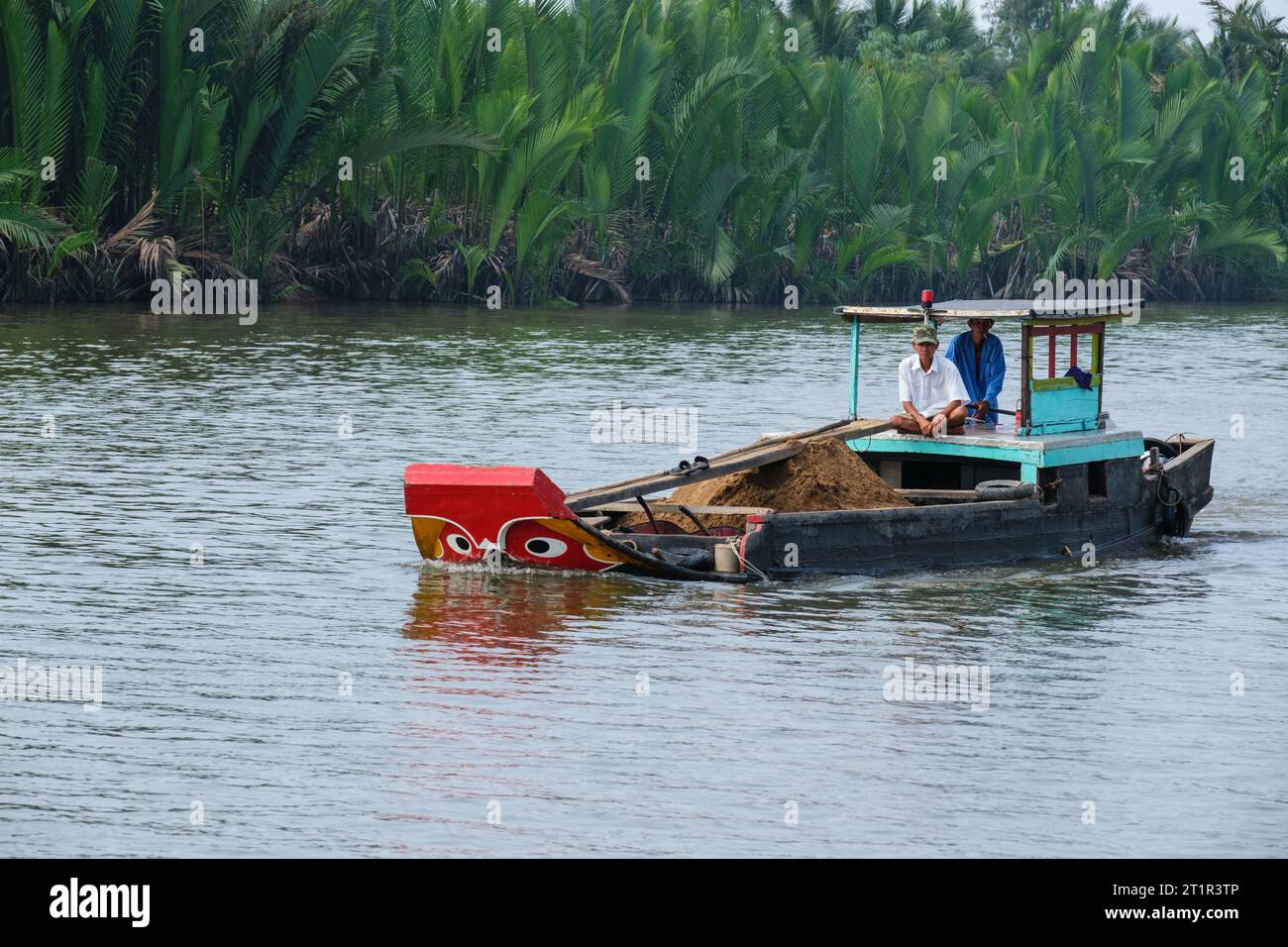 Small Boat Transport on Saigon River, near Ho Chi Minh, Vietnam. Stock Photo