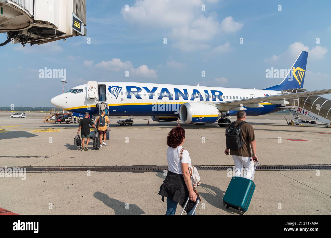 Ferno, Milan-Malpensa, Italy - October 3, 2023: Passengers boarding at low cost airline company Ryanair in the Milan-Malpensa international airport. Stock Photo