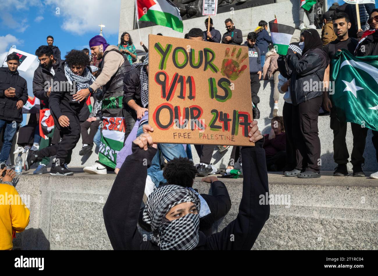London, UK. 14 Oct 2023: A female pro-Palestinian protester holds a 'Free Palestine' placard  in Trafalgar Square, London, UK at a demonstration again Stock Photo