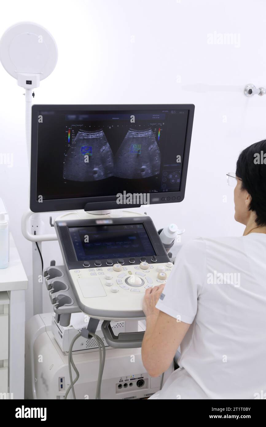 Ultrasonic examination of internal organs. A man on an abdominal