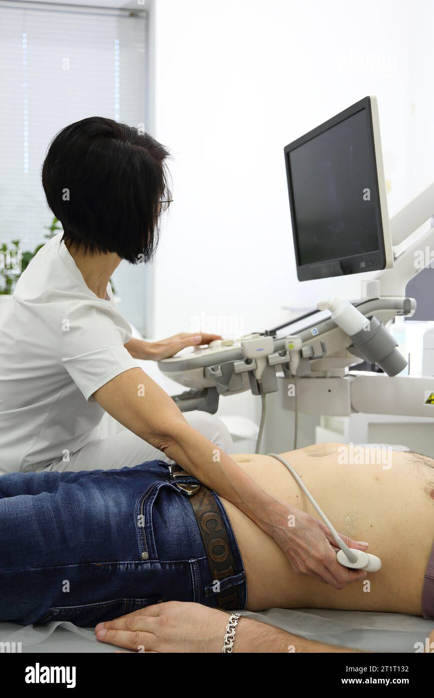 Ultrasonic examination of internal organs. A man on an abdominal