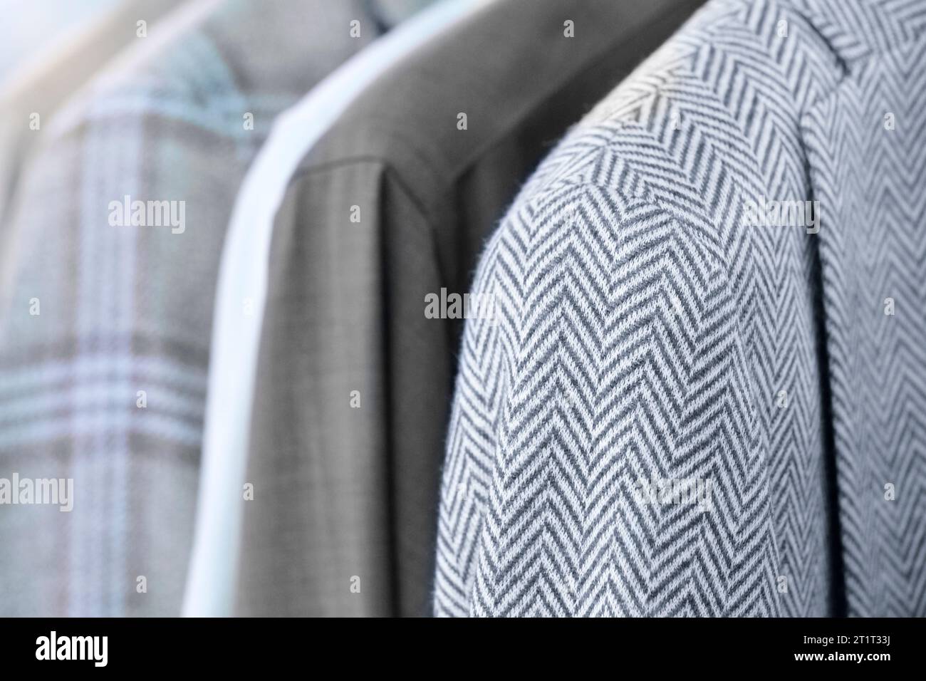 Racks with different men's suits in a men's clothing boutique Stock ...