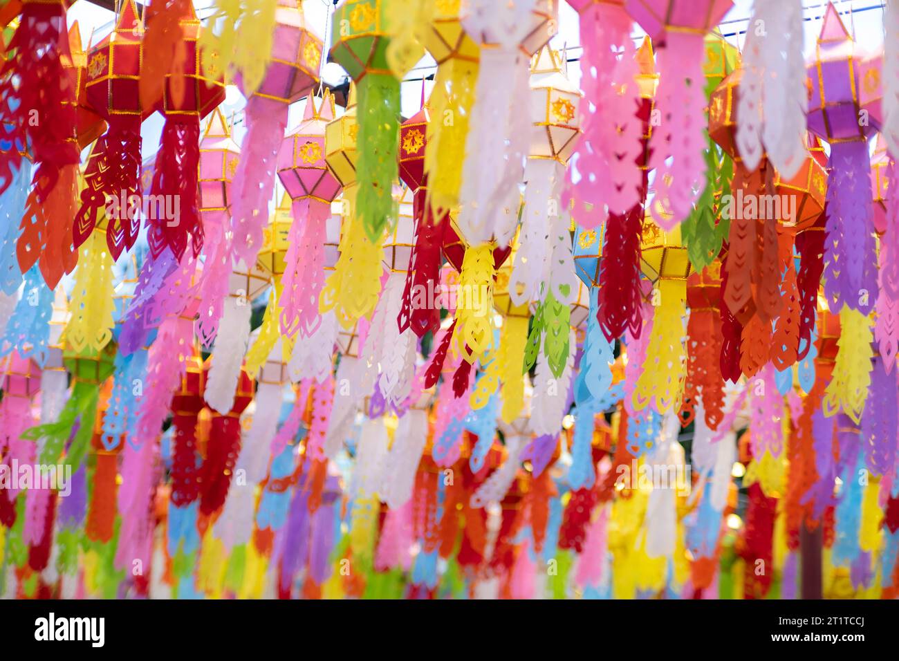 Colorful Lanna paper lanterns hang in Lamphun temples. Popular lantern festival during Loy Krathong in northern Thailand. Traditional Yi Peng paper la Stock Photo