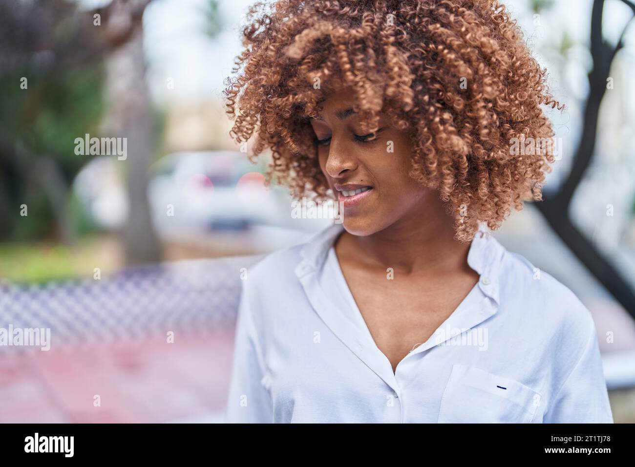 African american woman smiling confident looking to the side at park ...