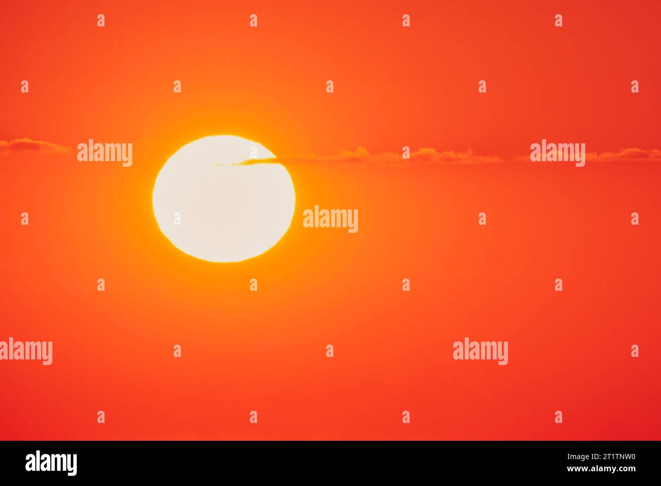 The clear sky was filled with a beautiful orange sunset Stock Photo - Alamy