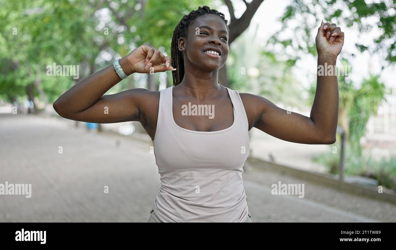African american woman smiling confident dancing at park Stock Photo ...