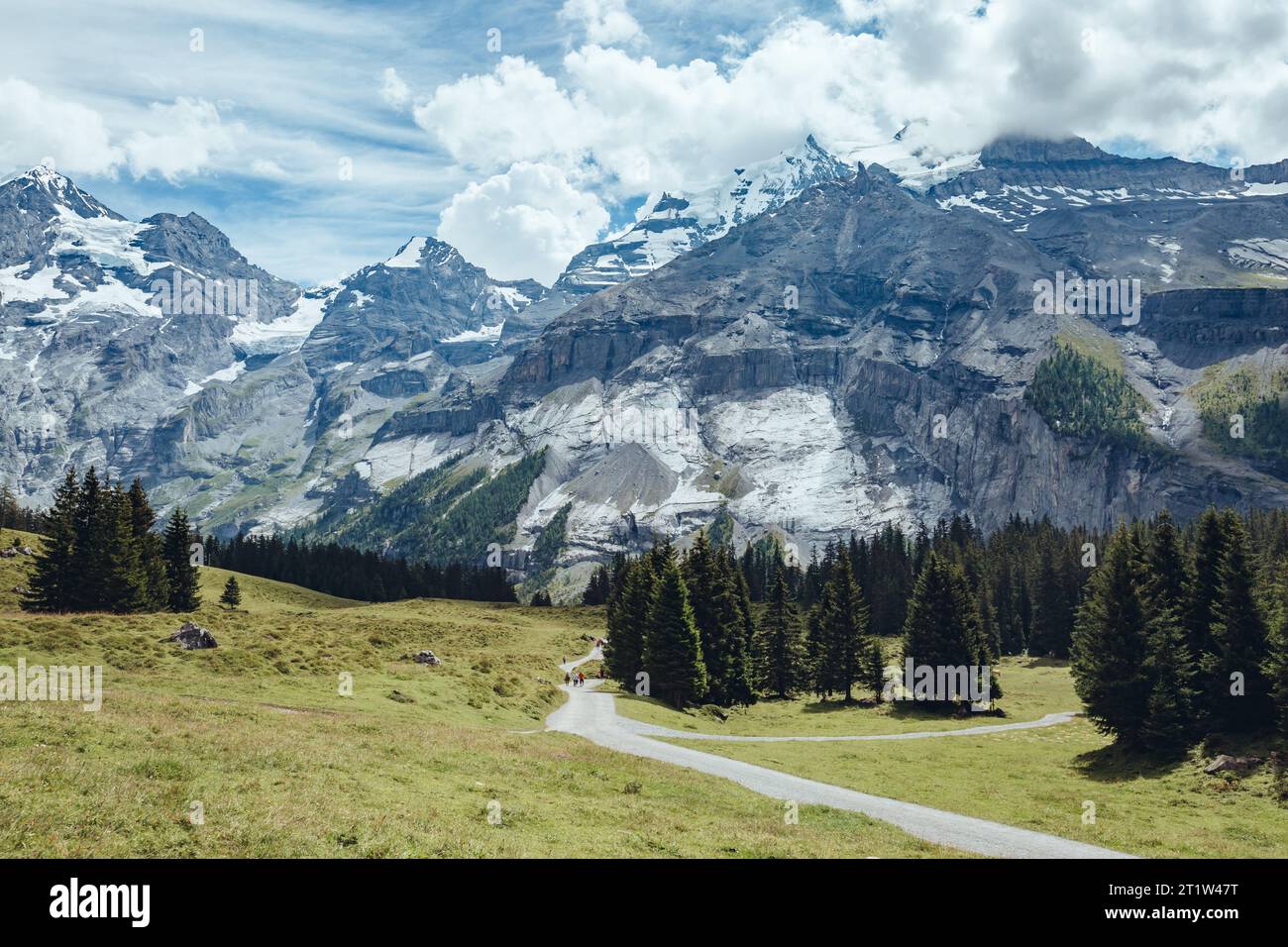 The road to the picturesque glacial lakes Oeschinensee. Popular tourist attraction. Gorgeous scene. Location Swiss alps, Kandersteg, Bernese Oberland, Stock Photo