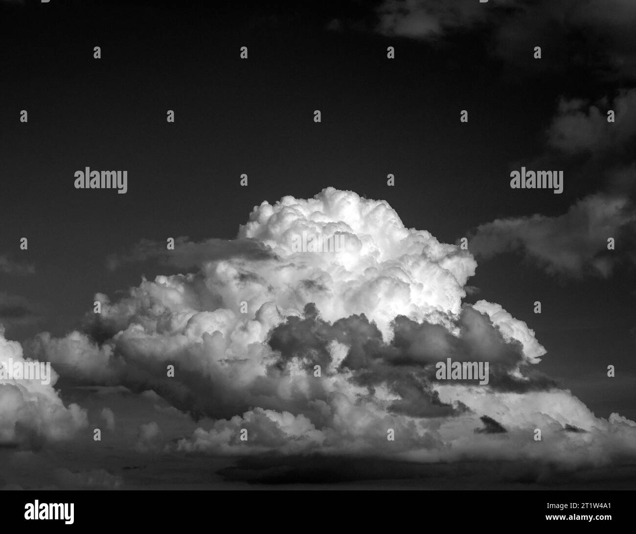 Black and White Beautiful sky with fluffy white clouds over modern city ...