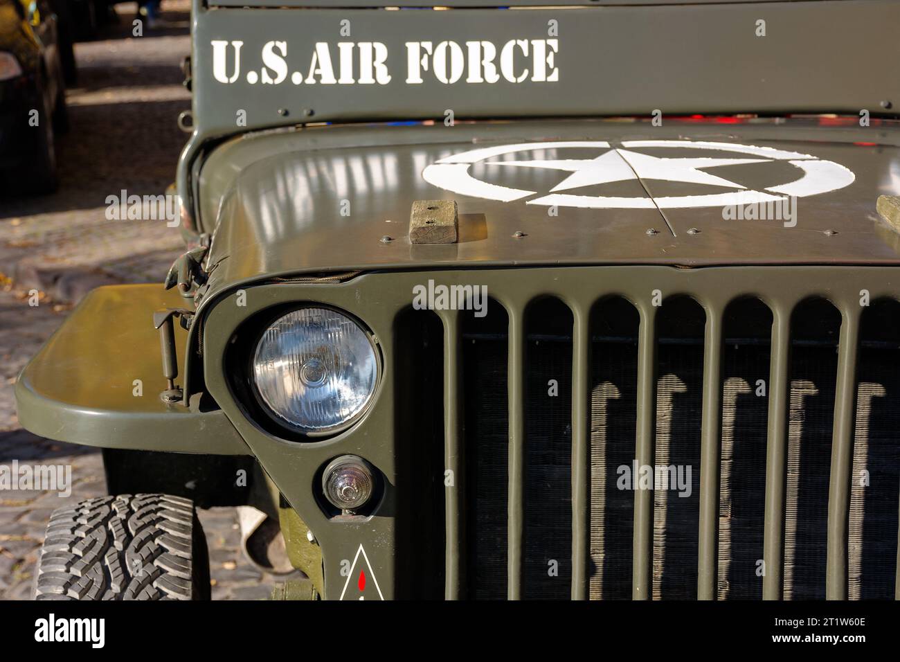 uzhgorod, ukraine - 31 oct 2021: close-up of a military vehicle grille and headlights. old us air force jeep with star on the hood Stock Photo