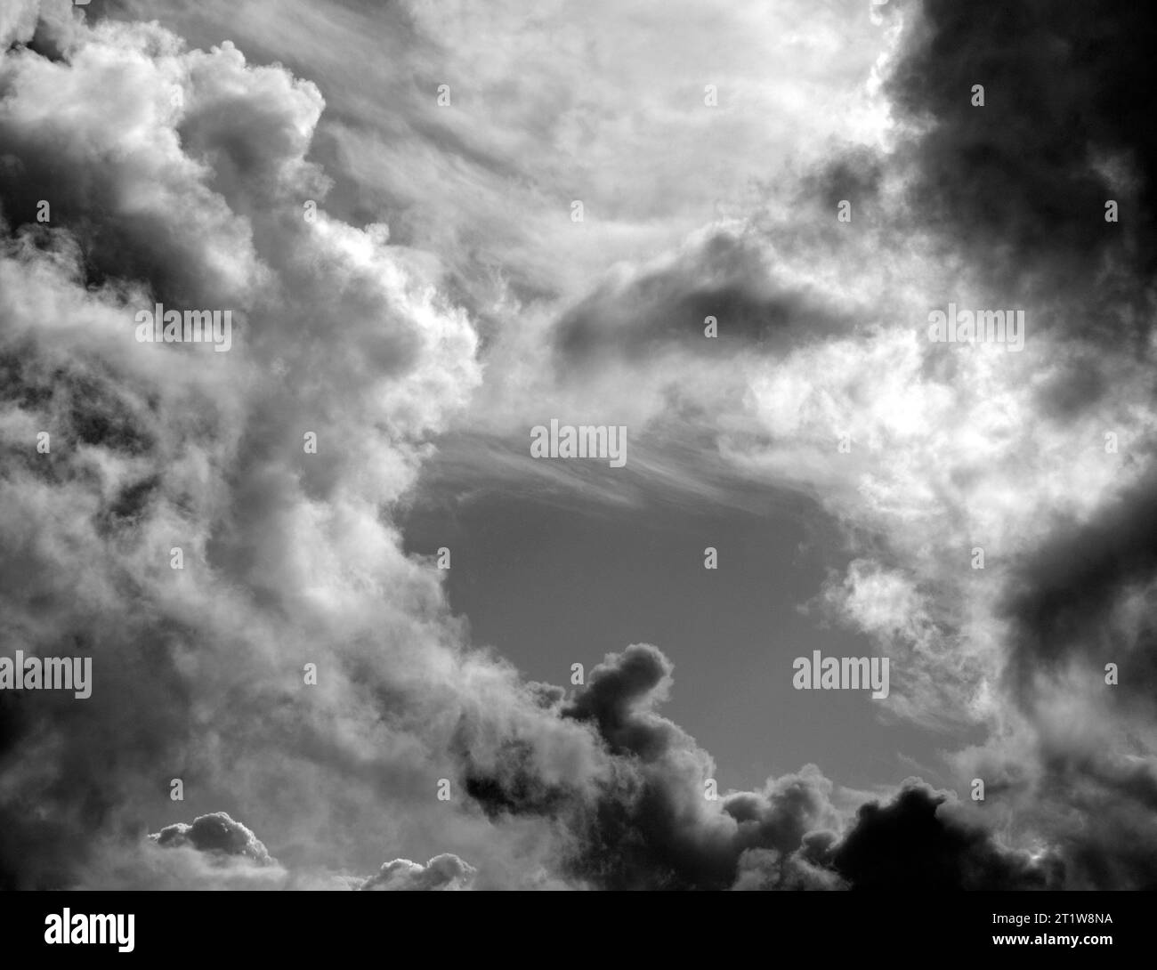 Black and White Beautiful sky with fluffy white clouds over modern city background, cloudscape wallpaper Stock Photo