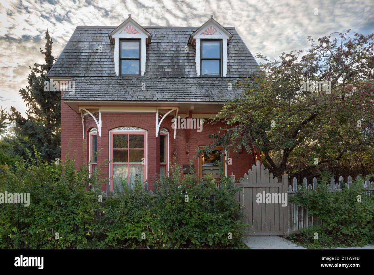 Sunrise over the ca 1891 Frank and Mary Harney historic brick house in