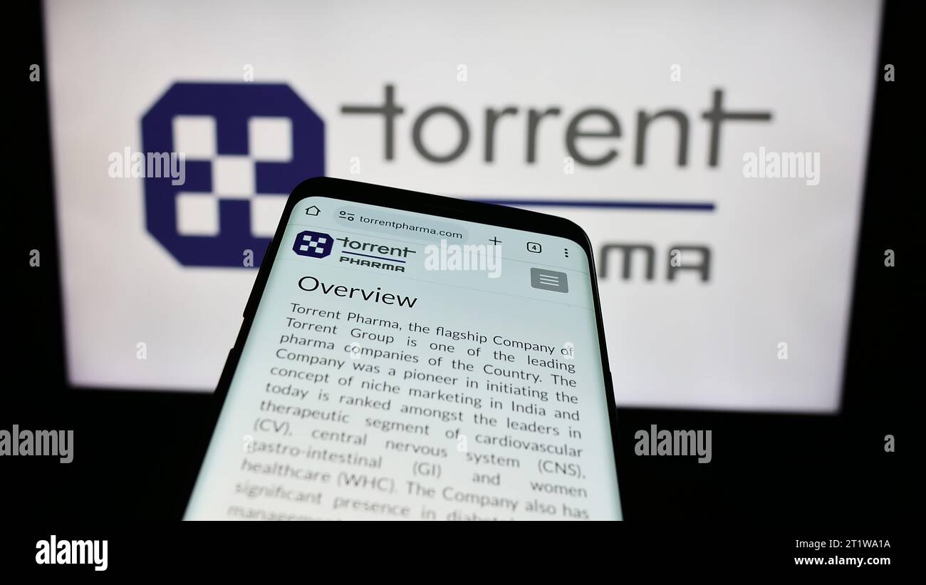 Mobile phone with website of Indian company Torrent Pharmaceuticals Limited  in front of business logo. Focus on top-left of phone display Stock Photo -  Alamy