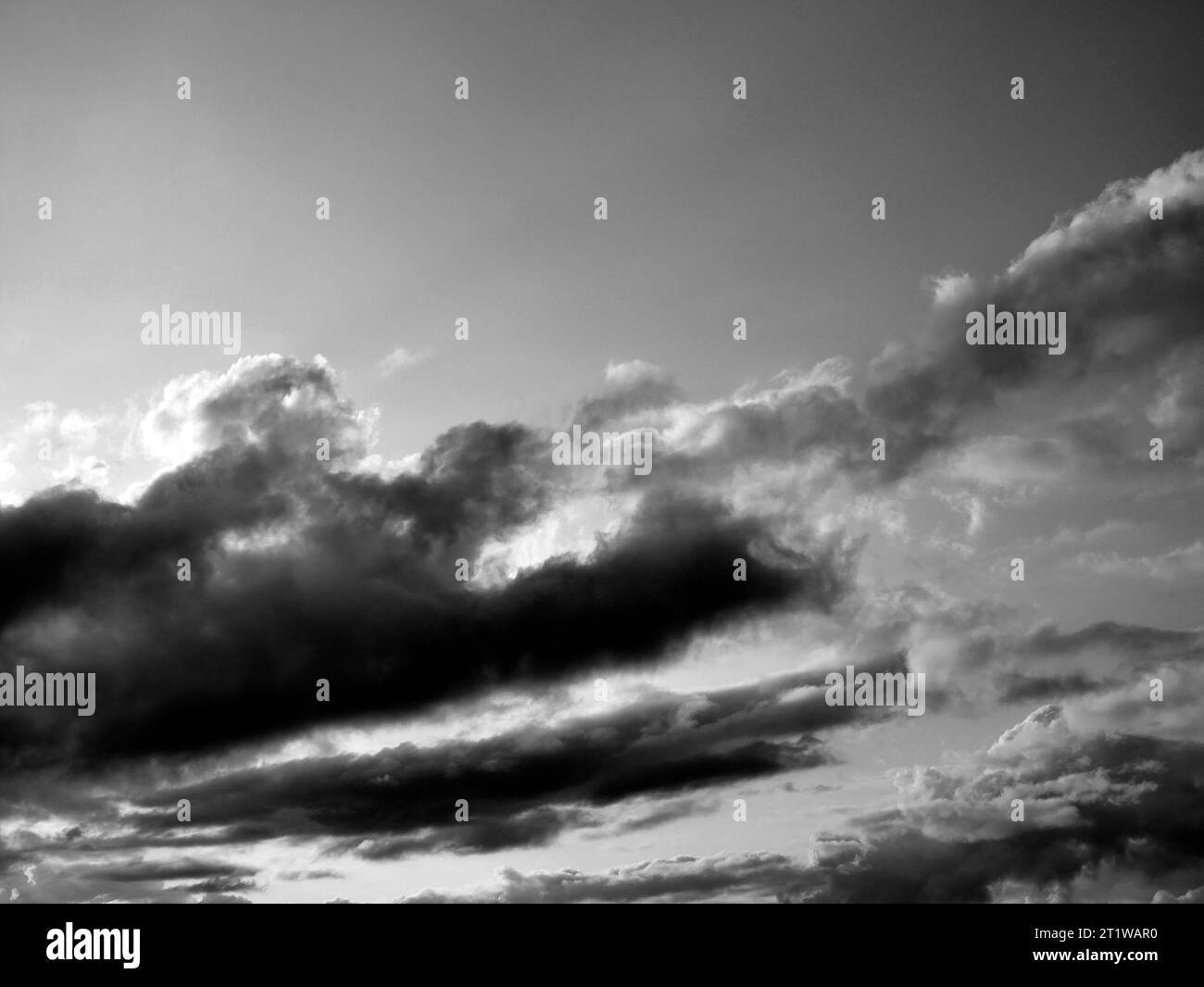 Black and White Beautiful sky with fluffy white clouds over modern city ...