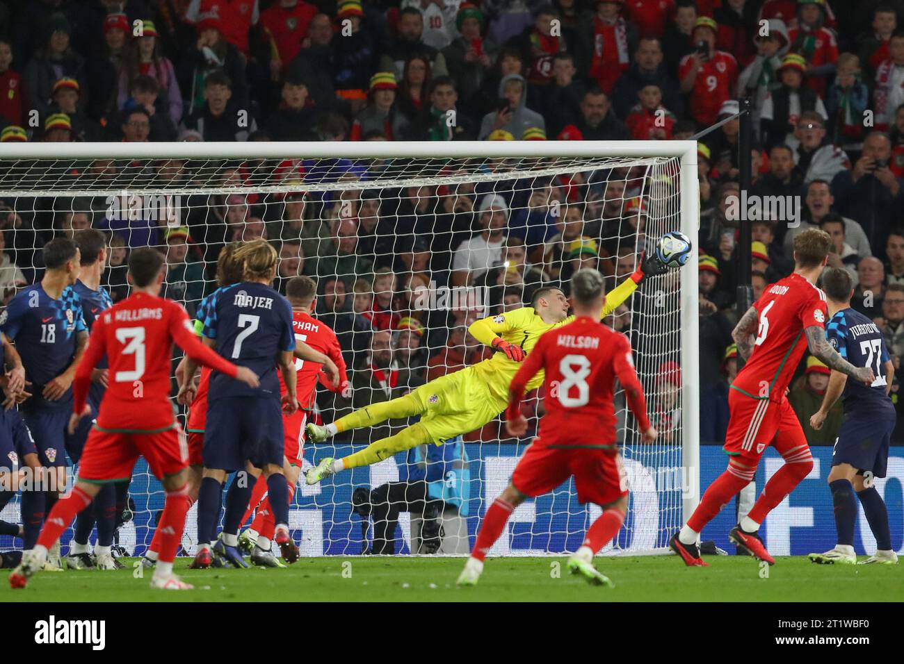 Dominik Livaković 1 of Croatia saves a free kick from Harry Wilson of