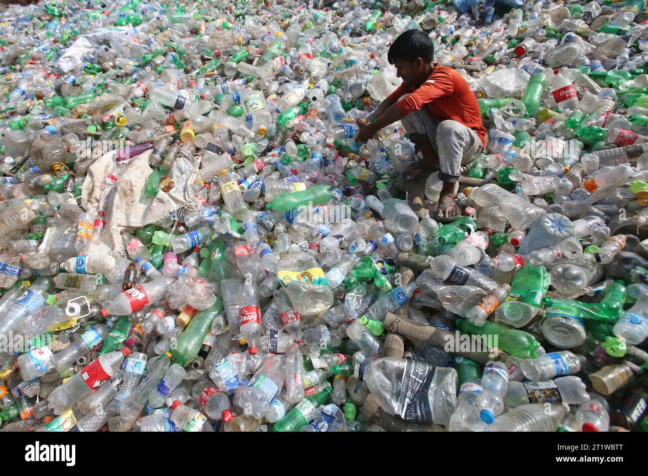 Dhaka, Bangladesh. 15th Oct, 2023. Employees recycling empty pet bottles to be reused again in a