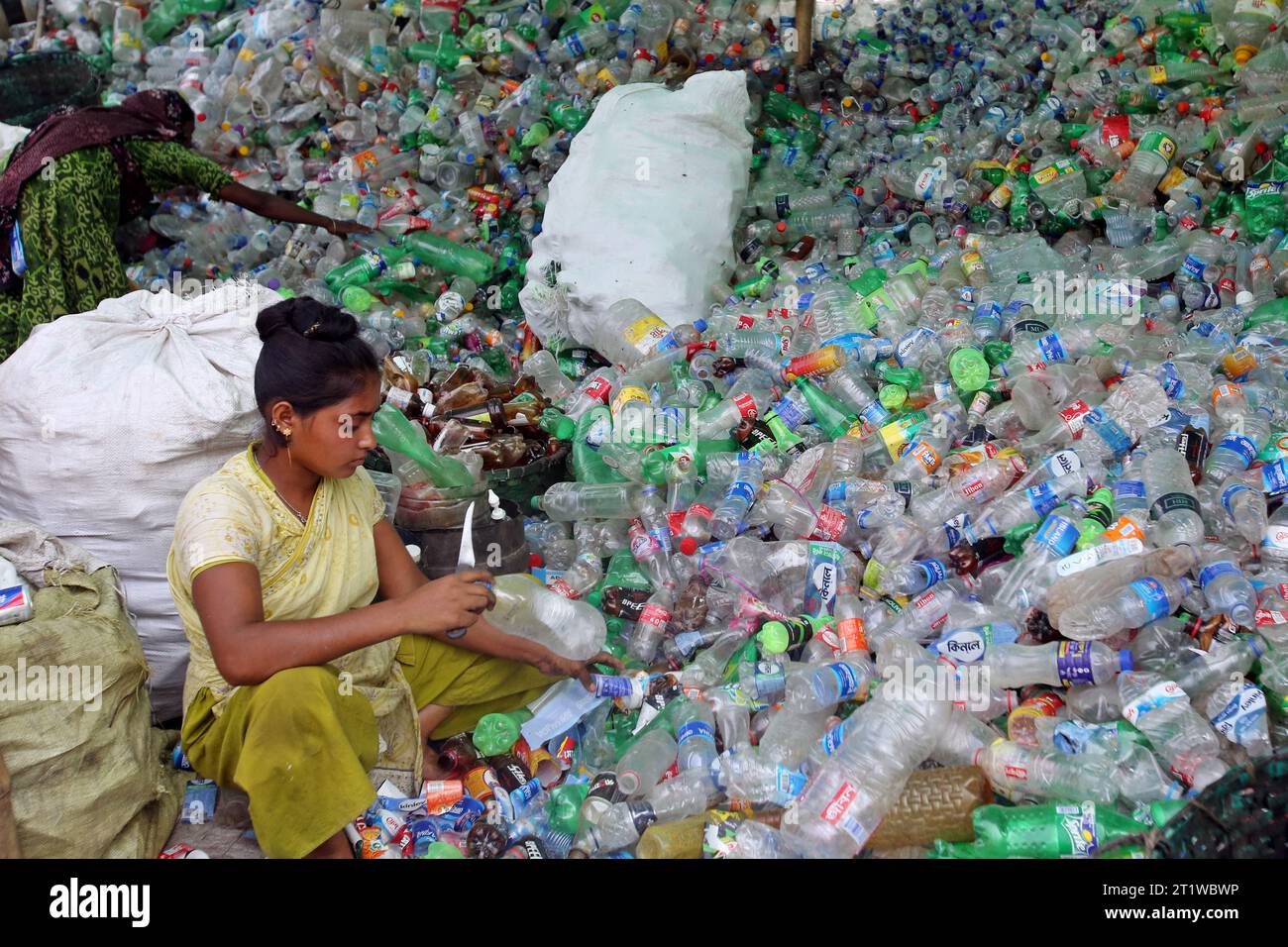 Dhaka, Bangladesh. 15th Oct, 2023. Employees recycling empty pet