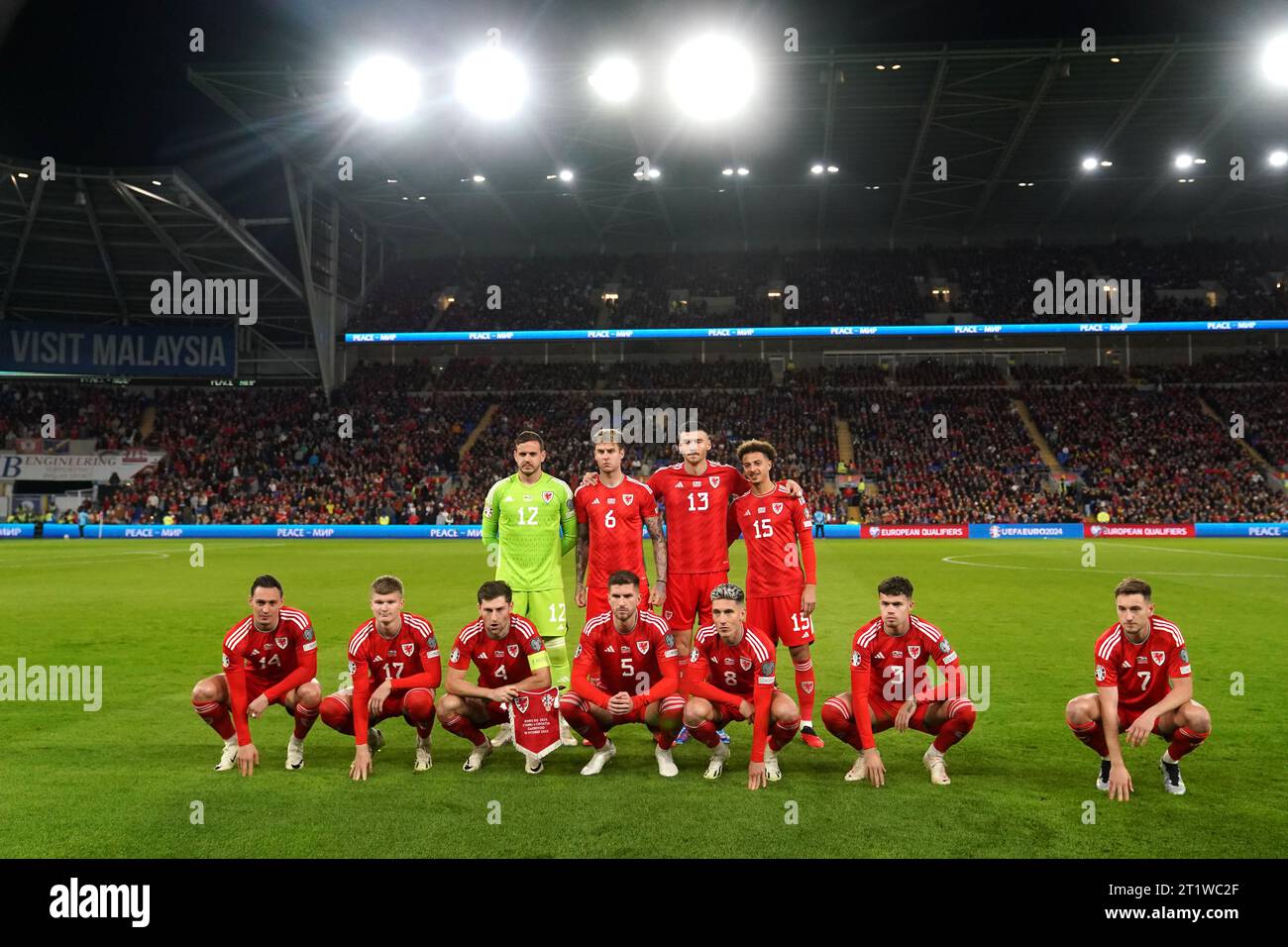 (left to right, back to front) Wales' goalkeeper Danny Ward, Joe Rodon, Kieffer Moore, Ethan Ampadu, Connor Roberts, Jordan James, Ben Davies, Chris Mepham, Harry Wilson, Neco Williams and David Brooks before the UEFA Euro 2024 Qualifying Group D match at the Cardiff City Stadium, Wales. Picture date: Sunday October 15, 2023. Stock Photo
