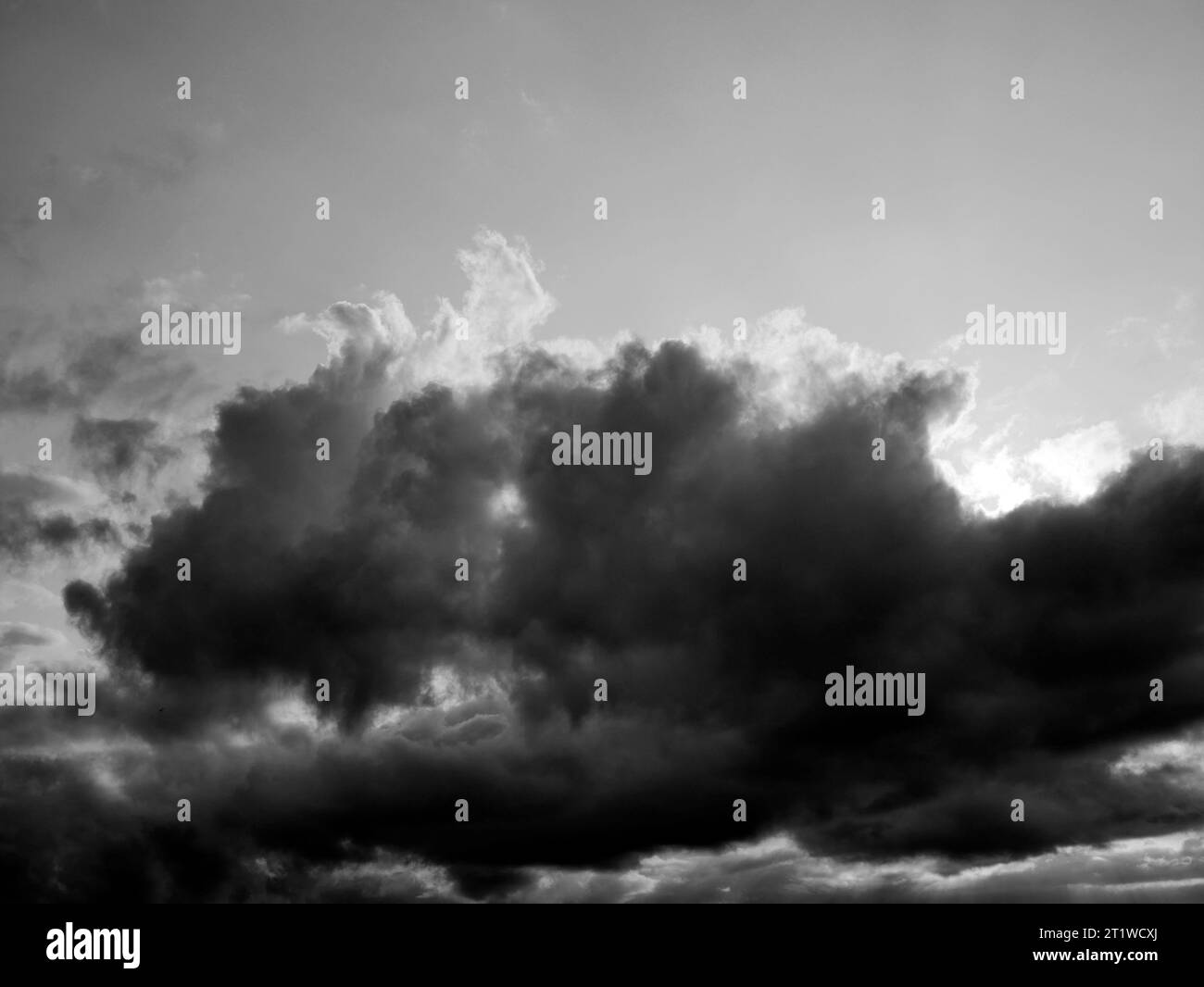 Black and White Beautiful sky with fluffy white clouds over modern city ...
