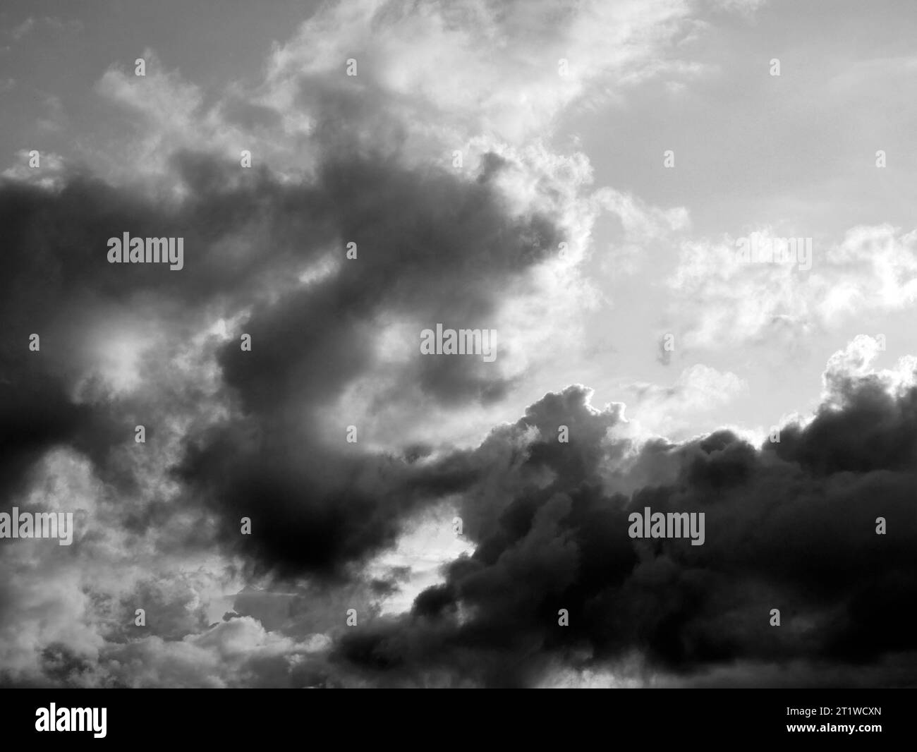 Black and White Beautiful sky with fluffy white clouds over modern city background, cloudscape wallpaper Stock Photo