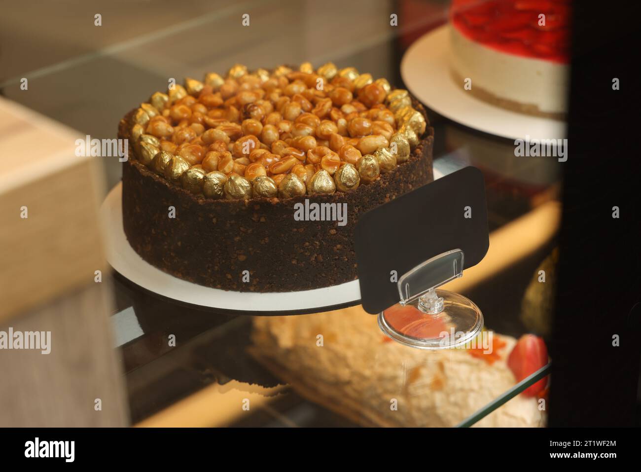 Woman baking chocolate cup cakes in glass tray in kitchen closeup. Young  girl put muffins in hot over. Female cooking tasty snack pastry at home.  Hea Stock Photo - Alamy