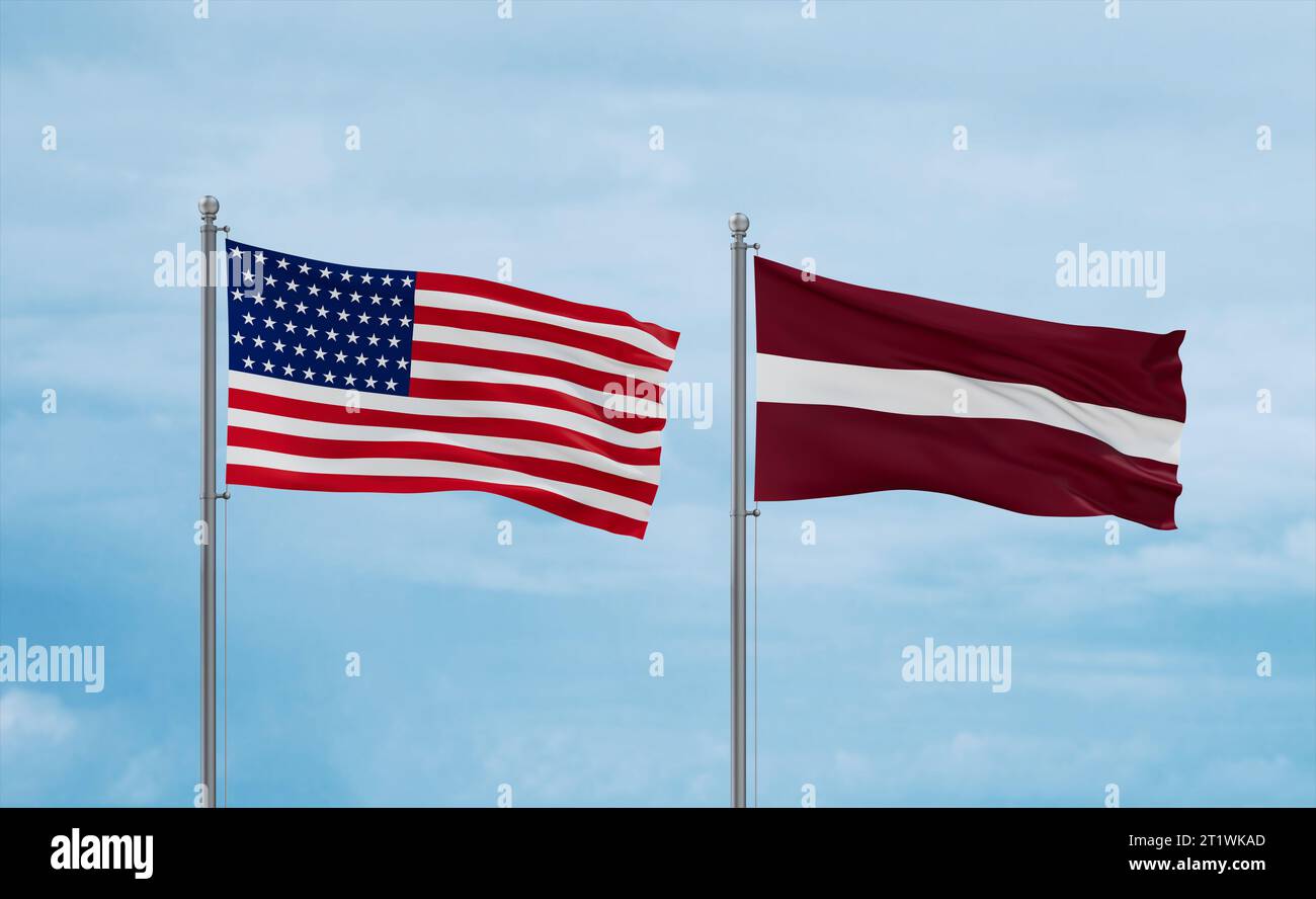 Latvia and USA flags waving together in the wind on blue cloudy sky ...