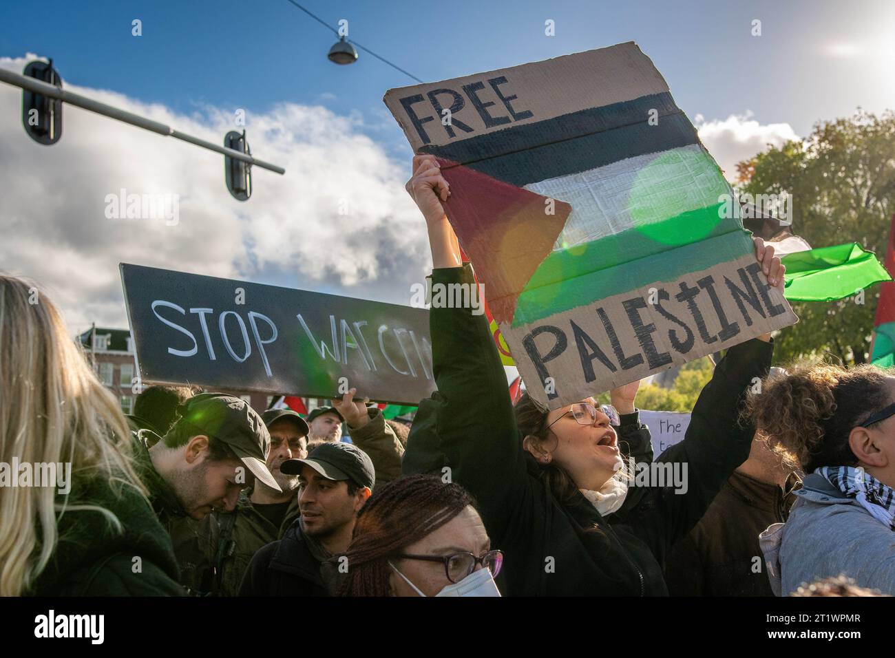 Amsterdam, North Holland, Netherlands. 15th Oct, 2023. A pro-Palestinian demonstrator holds a ''Free Palestine'' sign as she marches through the streets of Amsterdam. On October 25, 2023, thousands of pro-Palestinian demonstrators gathered at Dam Square, Amsterdam, and proceeded to march through the city. (Credit Image: © James Petermeier/ZUMA Press Wire) EDITORIAL USAGE ONLY! Not for Commercial USAGE! Stock Photo