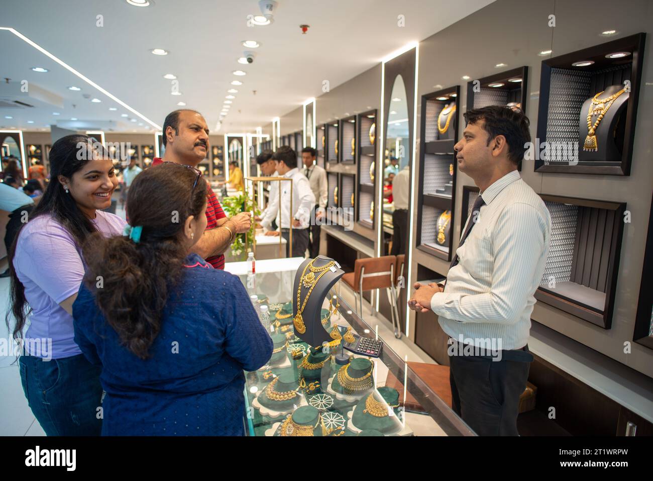 New Delhi, India. 15th Oct, 2023. Customers buy jewelry at the newly open Kalyan jewelers showroom at Karol Bagh, New Delhi. Kalyan Jewelers is an Indian chain of jewelry showrooms. It was founded by T. S. Kalyanaraman in 1993. Credit: SOPA Images Limited/Alamy Live News Stock Photo
