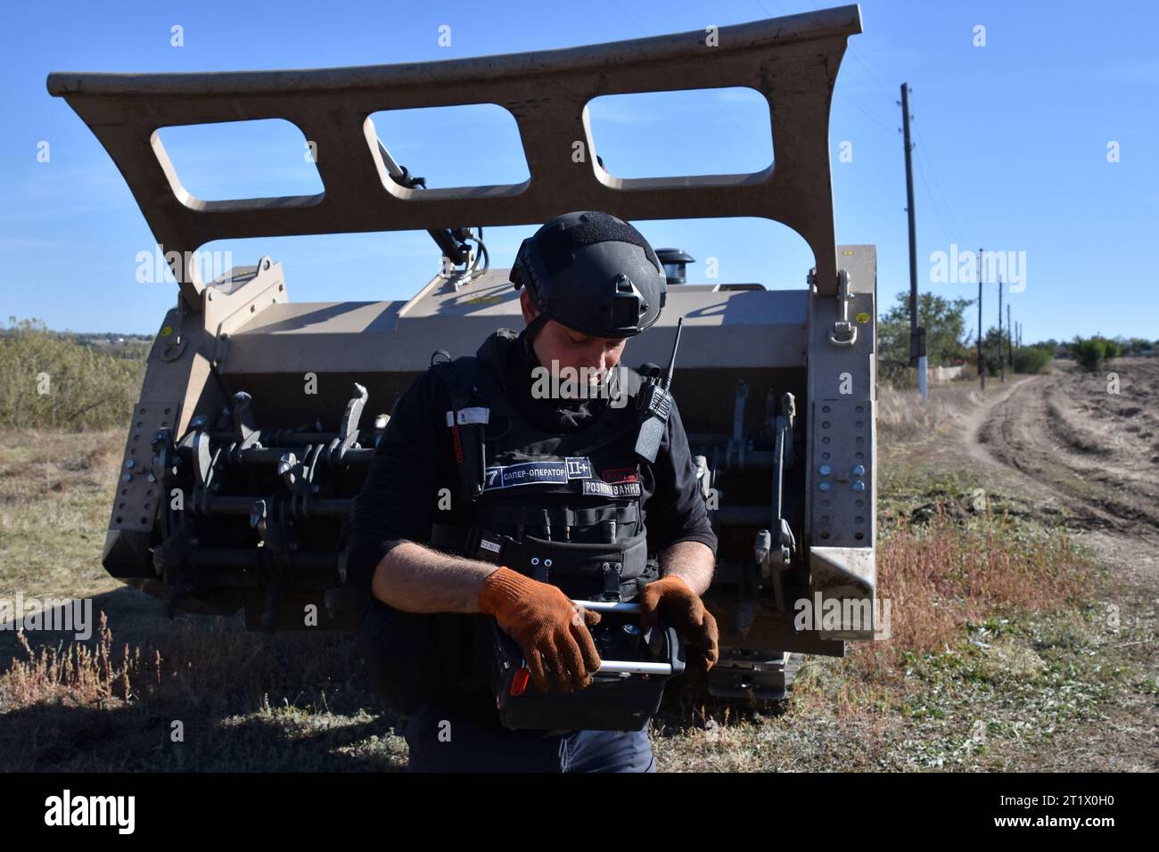 A Ukrainian sapper operates the unmanned demining vehicle during the demining operation in Velyka Oleksandrivka. In March 2022, Velyka Oleksandrivka was occupied by Russian forces. On 4 October 2022, Ukrainian authorities regained control of the settlement during the Southern counteroffensive. War-battered northern Kyiv, Sumy, Chernihiv, southern Mykolaiv, Zaporizhzhia, Kherson, and eastern Kharkiv, Luhansk, and Donetsk regions are the most mined, according to Ukraine's State Emergency Service. It takes at least ten years to clear these areas. (Photo by Andriy Andriyenko/SOPA Images/Sipa USA Stock Photo