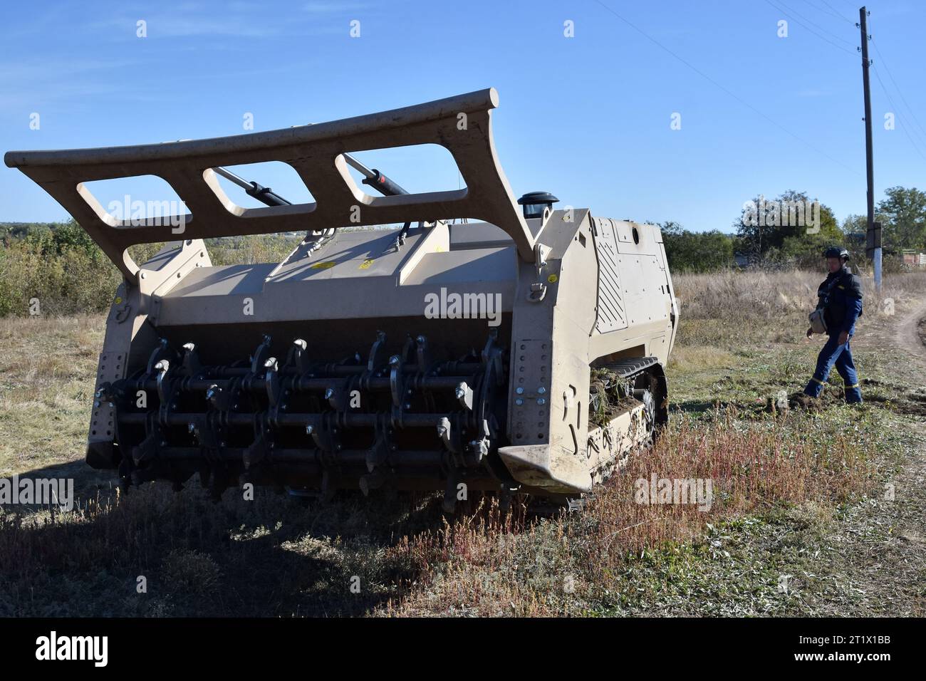 Velyka Oleksandrivka, Ukraine. 12th Oct, 2023. A Ukrainian sapper operates the unmanned demining vehicle during the demining operation in Velyka Oleksandrivka. In March 2022, Velyka Oleksandrivka was occupied by Russian forces. On 4 October 2022, Ukrainian authorities regained control of the settlement during the Southern counteroffensive. War-battered northern Kyiv, Sumy, Chernihiv, southern Mykolaiv, Zaporizhzhia, Kherson, and eastern Kharkiv, Luhansk, and Donetsk regions are the most mined, according to Ukraine's State Emergency Service. It takes at least ten years to clear these areas. ( Stock Photo