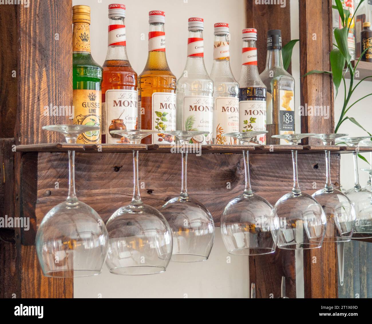 https://c8.alamy.com/comp/2T1X69D/batumi-georgia-10142023-glasses-hang-over-the-bar-counter-the-glasses-are-turned-upside-down-restaurant-interior-concept-of-drinking-alcoholic-2T1X69D.jpg