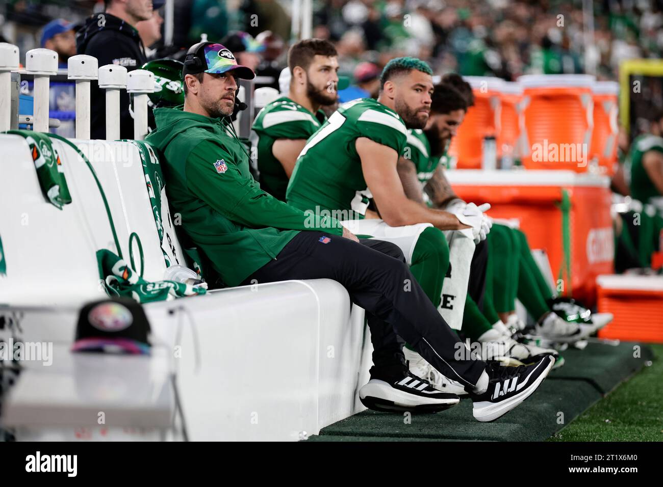 New York Jets quarterback Aaron Rodgers sits on the bench during the ...