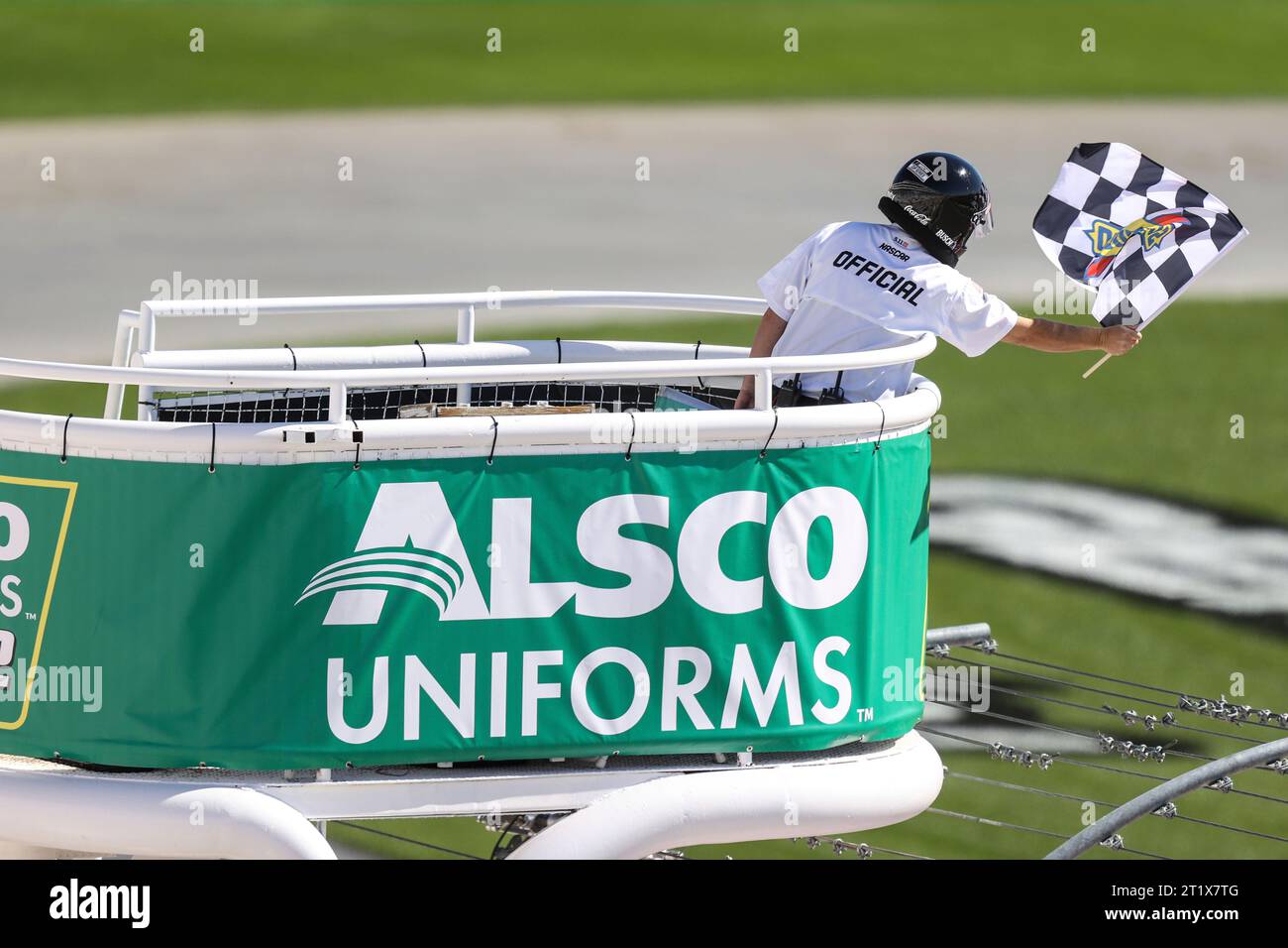 LAS VEGAS, NV - OCTOBER 14: A race official waves the checkered flag ...