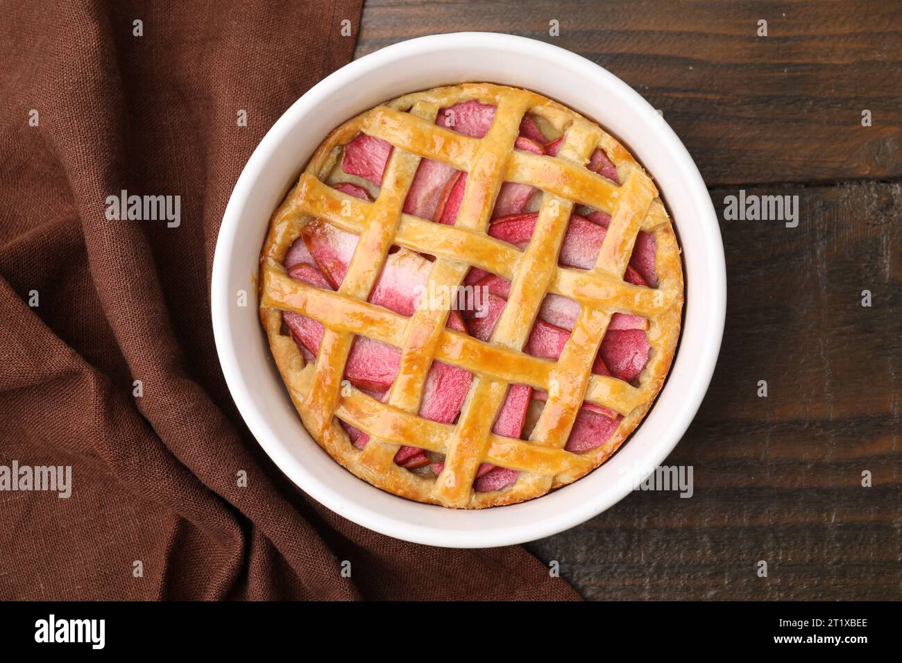 Baking dish with tasty apple pie on wooden table, top view Stock Photo