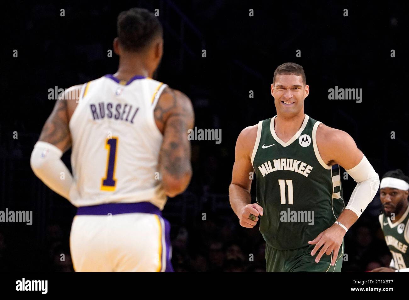 Milwaukee Bucks center Brook Lopez, right, smiles at Los Angeles Lakers ...