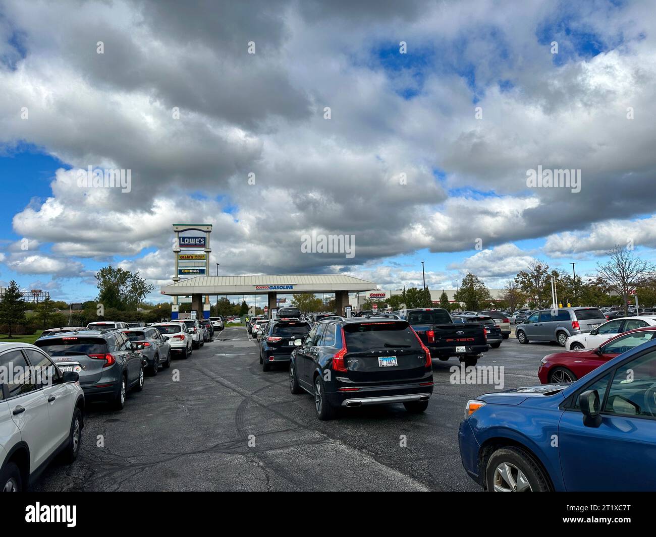 Cars lined up waiting to pump gas at a Costco Gas Station in Merrillville Indiana USA October 15, 2023 Stock Photo