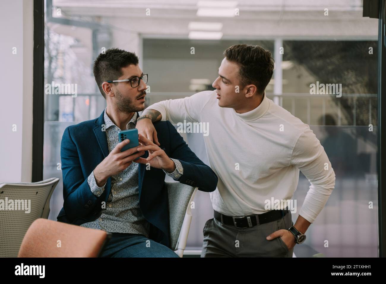 Two business partners talking Stock Photo - Alamy