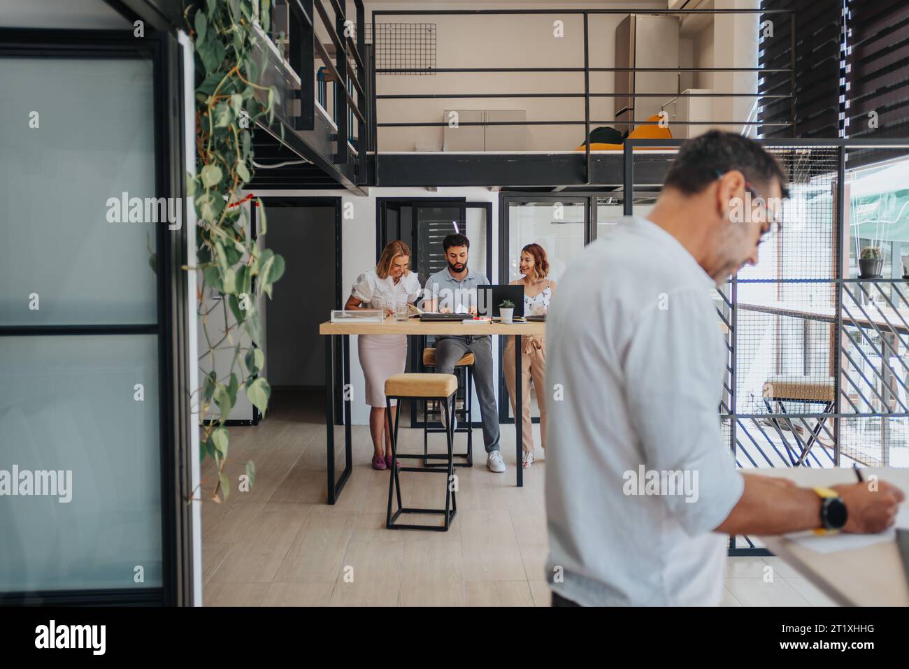 Efficient Team Analyzing Reports and Developing Strategic Business Plan Stock Photo