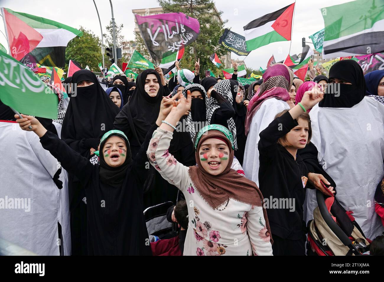 Children with Palestine painted flags on their faces are seen during a ...