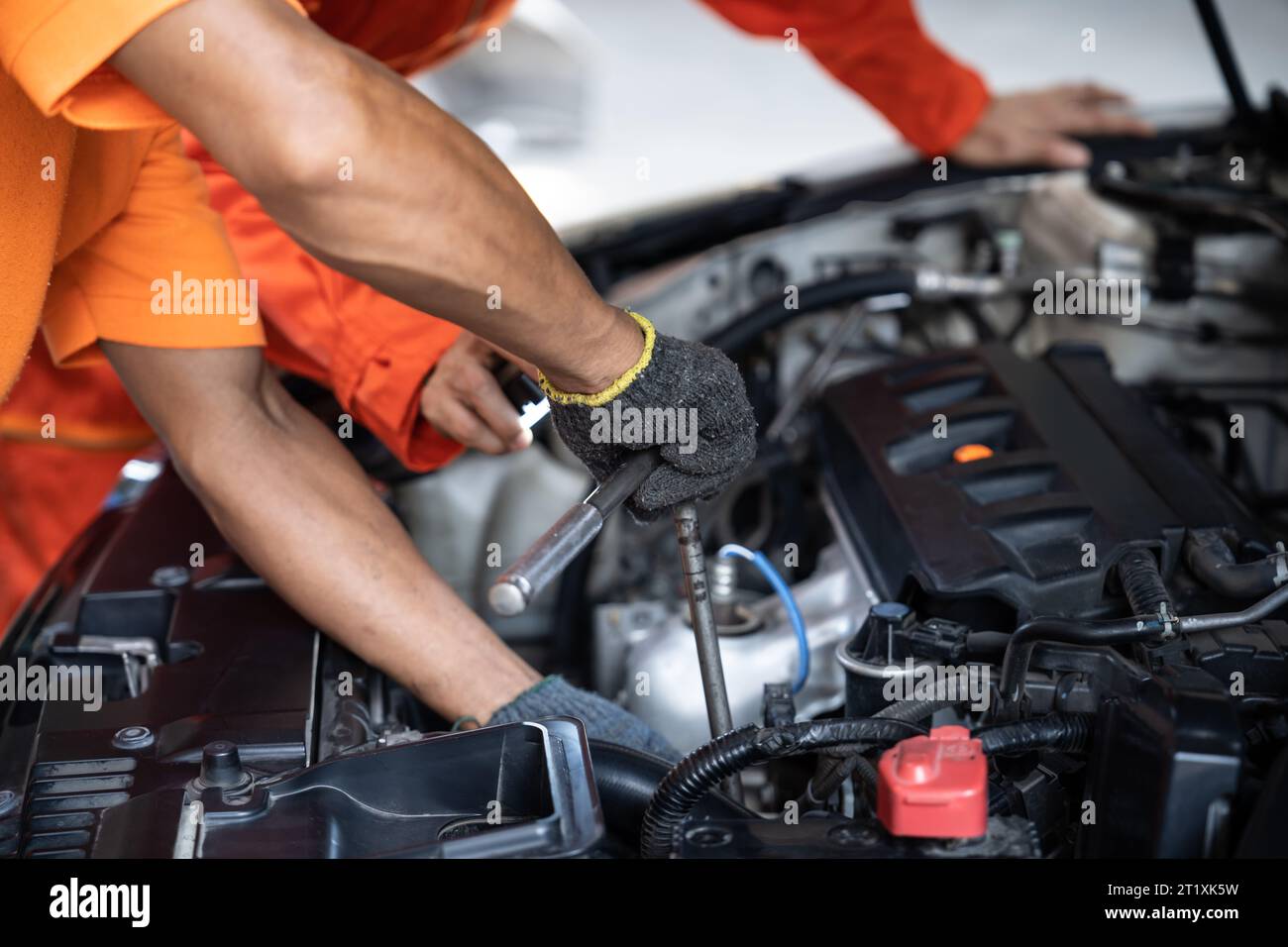 Automotive service mechanic inspect and diagnose car engine issue, repairing and fixing problem