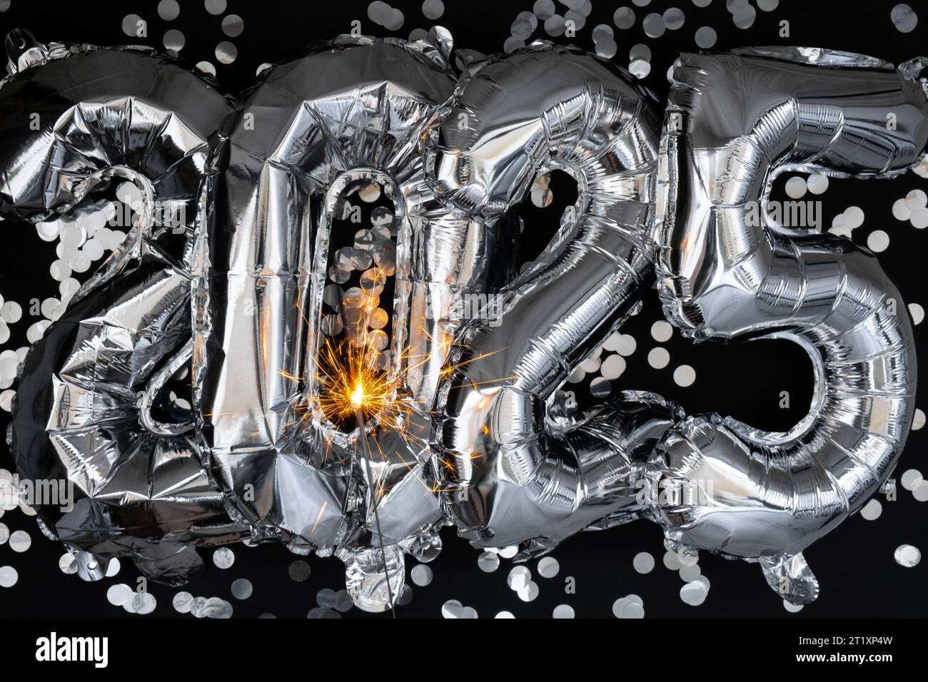 Happy New Year 2025 Metallic Balloons With Confetti And Sparkler Happy New Year 2025 Metallic Balloons With Confetti And Sparkler Firework Bengal Lights On Dark Black Background Greeting Card Silver Foil Balloons Numbers Christmas Holiday Concept Celebration Party Congratulation Decoration 2T1XP4W
