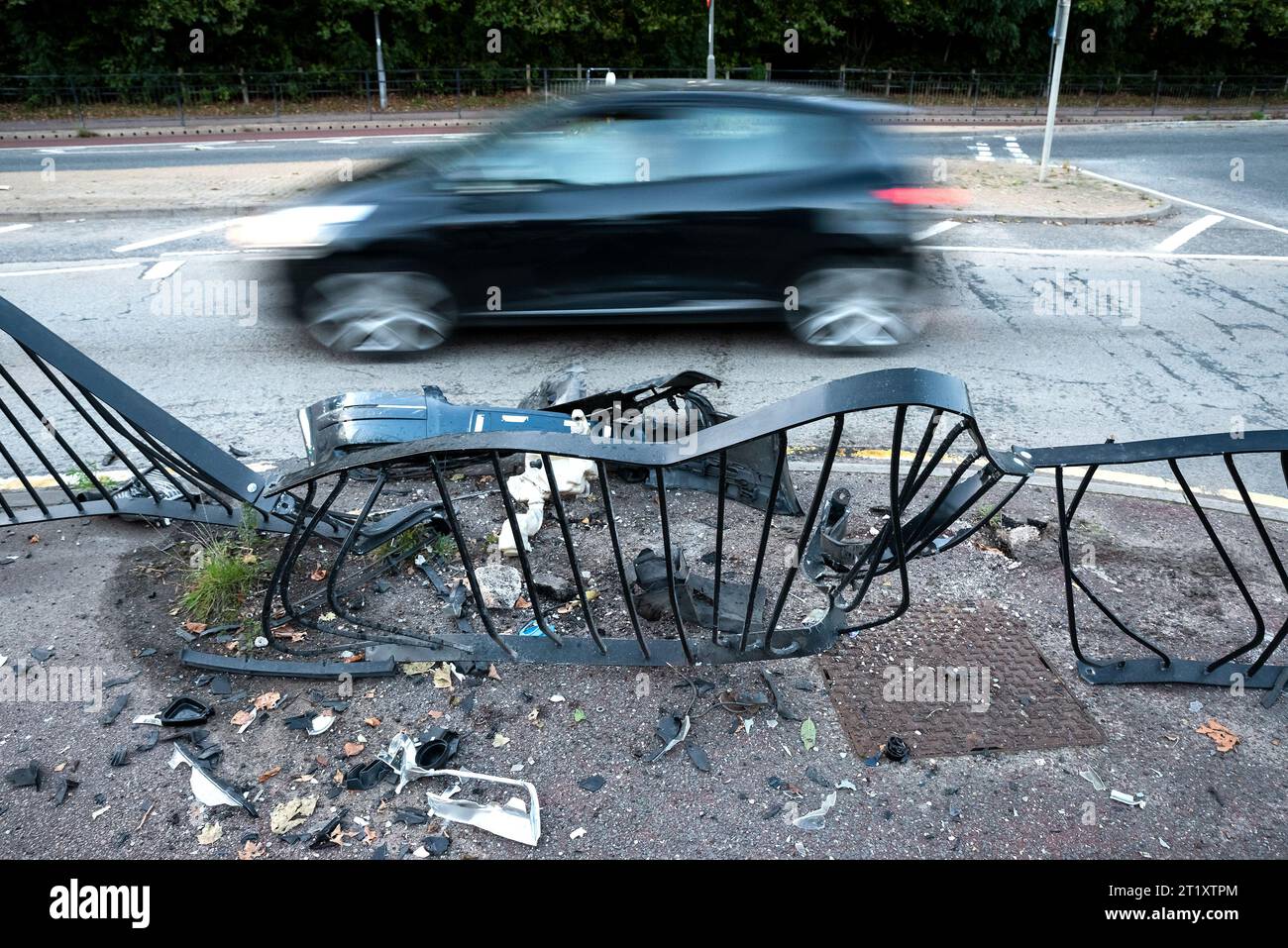 Serious vehicle impact damage to roadside pavement pedestrian barrier outside Aylesbury Sir Henry Floyd Grammar School. Credit: Stephen Bell/Alamy Stock Photo