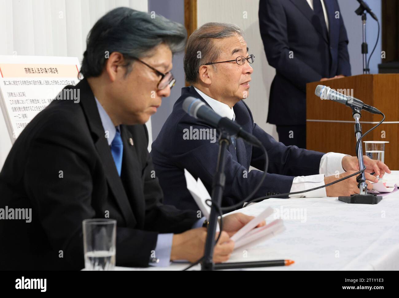 Nobuo Okamura (R) procurator general of the Family Federation for