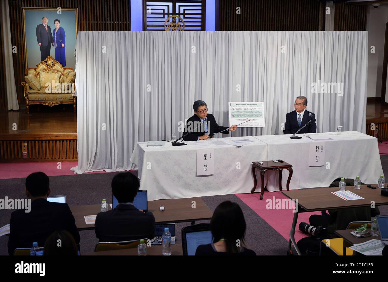 Nobuo Okamura (R) procurator general of the Family Federation for