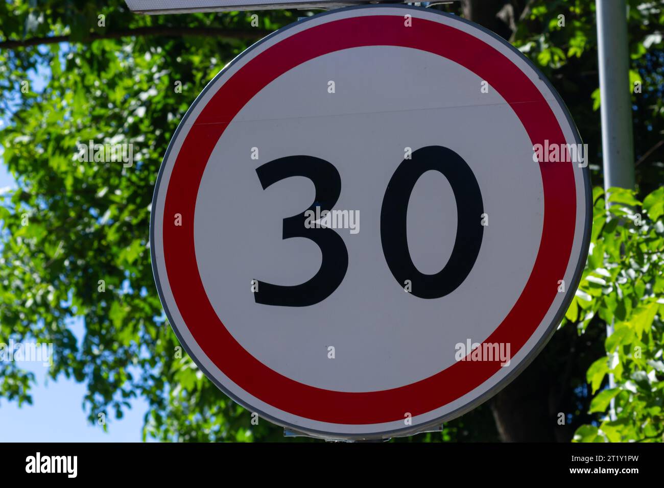 Traffic sign which means 30 kilometers per hour. Stock Photo