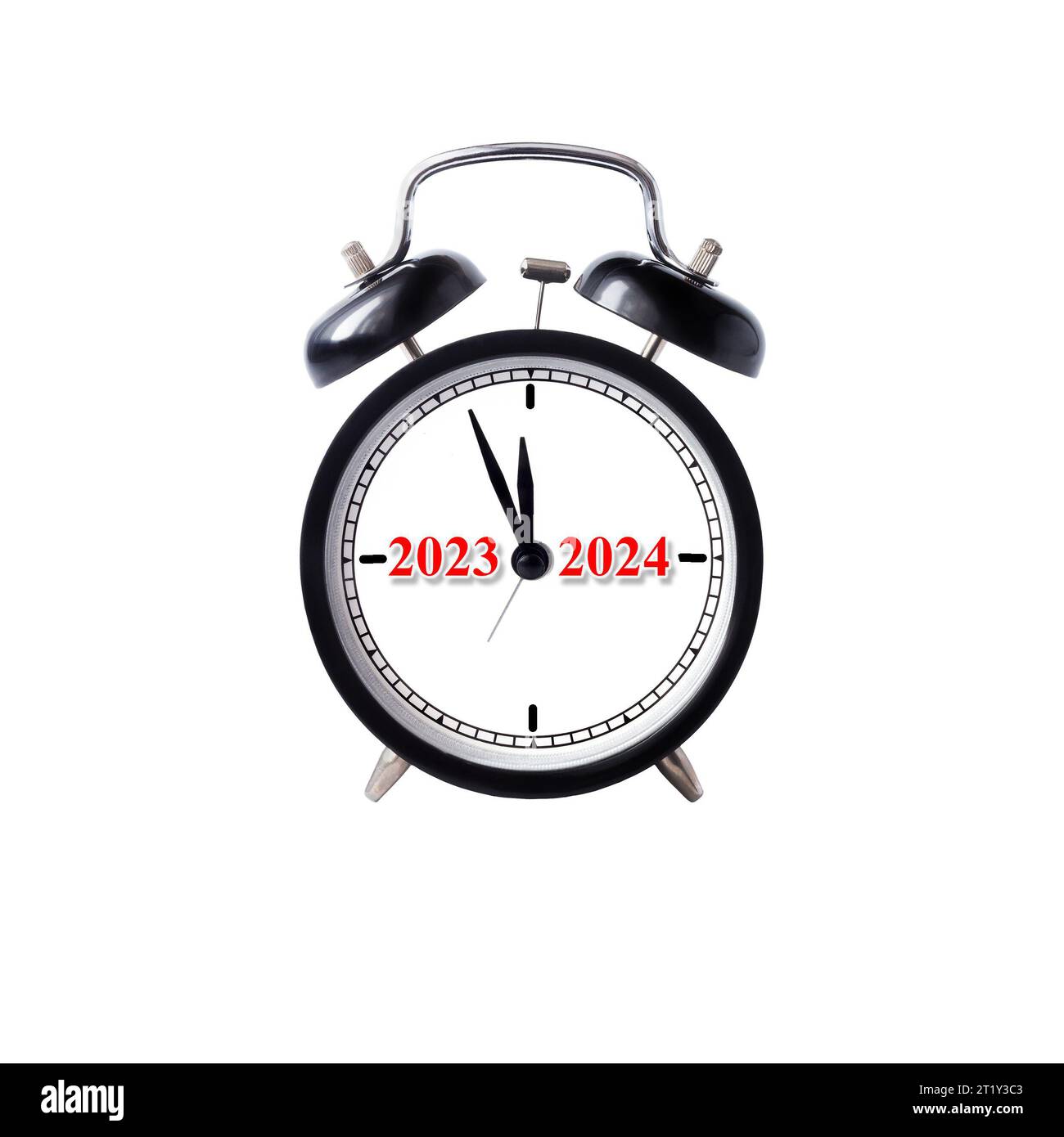 A classic alarm clock with 2023-2024 inscriptions on the dial. New Year concept. Stock Photo